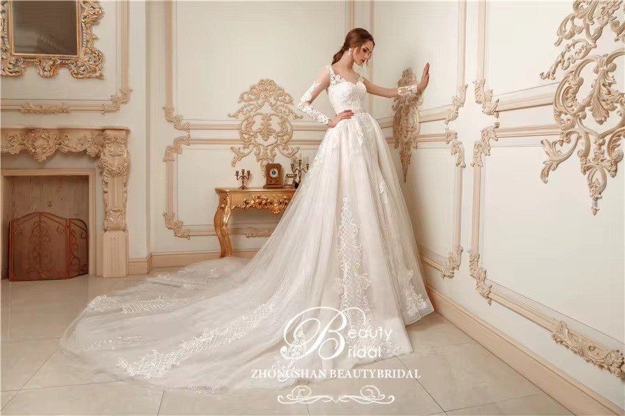 Best sale high quality long sleeves mermaid wedding dress with luxury beading and bid removable overskirt.